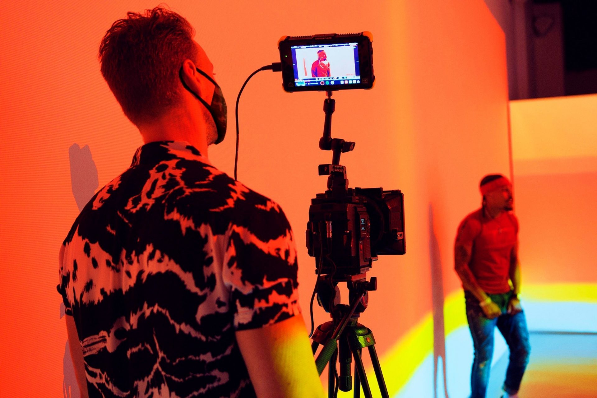 Camera man wearing Covid-19 mask